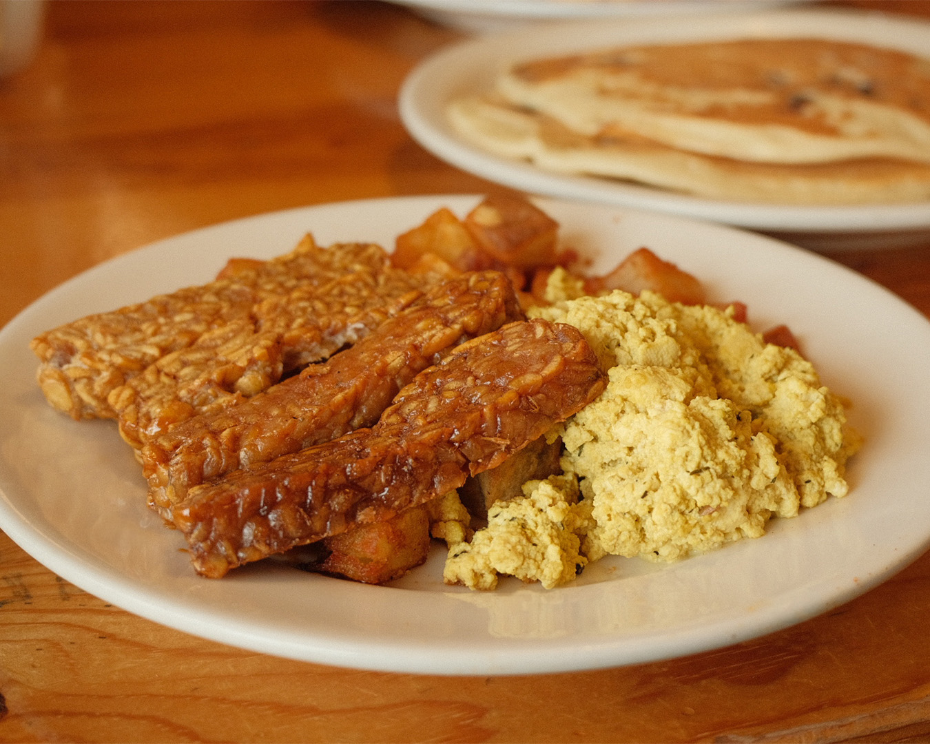 Tofu scramble, tempeh bacun, potatoes, and pancakes from Vertical Diner